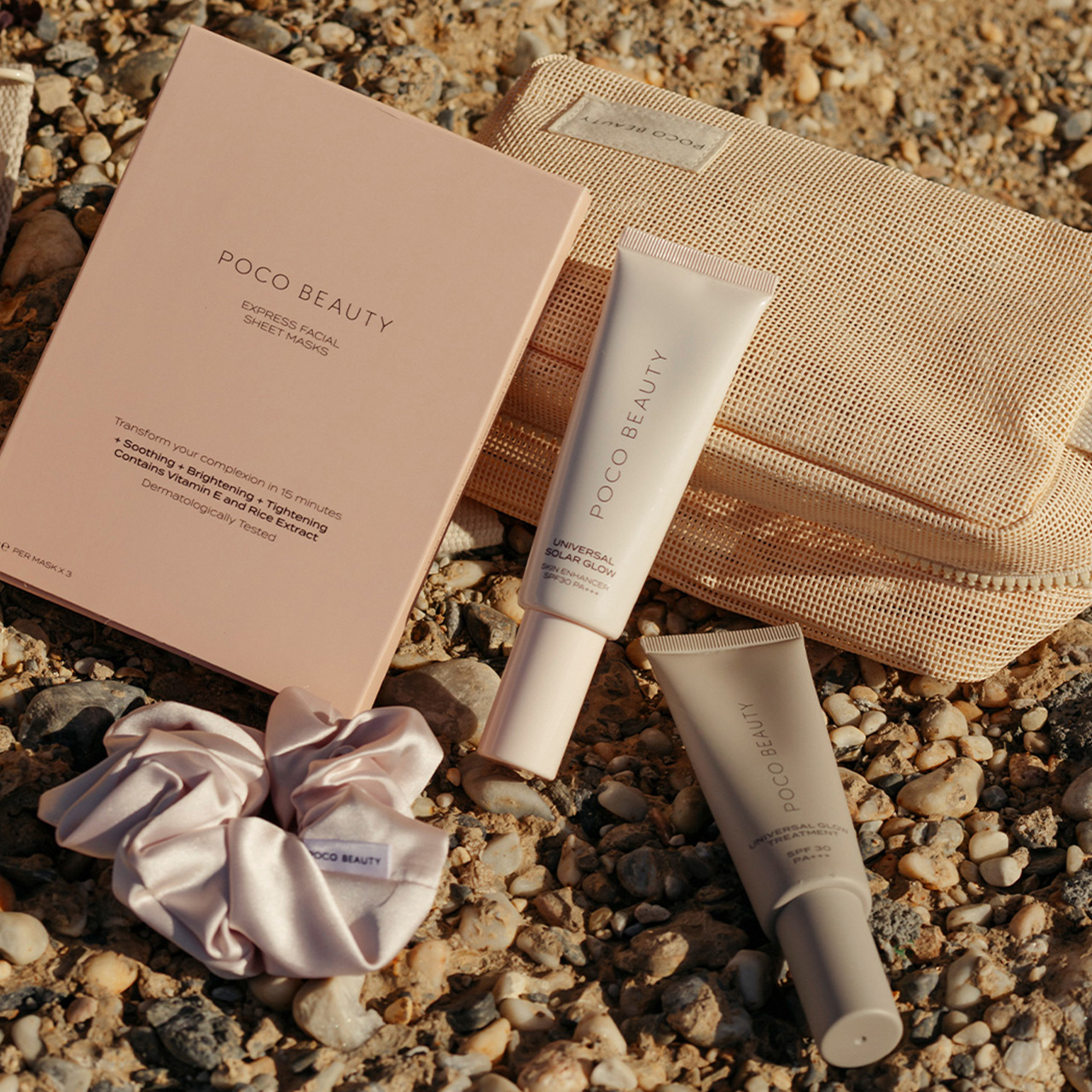 Poco Beauty mini skincare set with travel pouch, cream tube and moisturiser on sandy background
