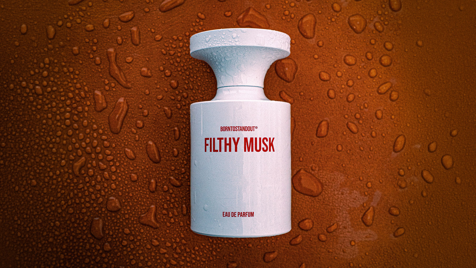 BORNTOSTANDOUT Filthy Musk eau de parfum bottle with white cap against textured bronze background