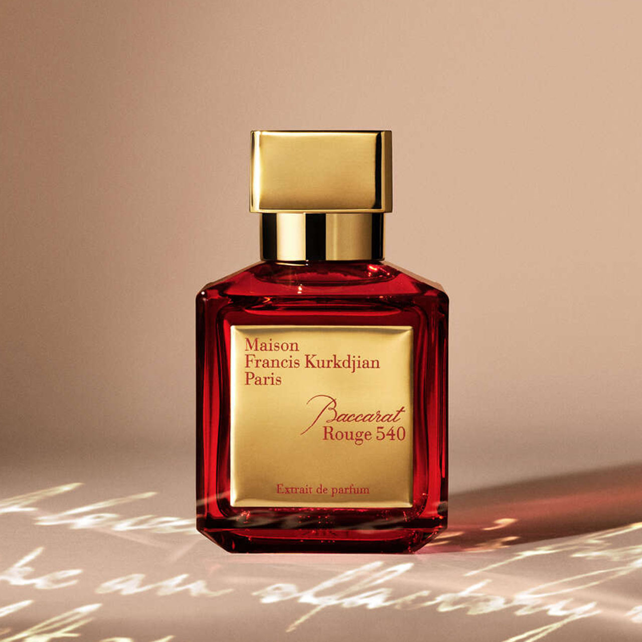 Maison Francis Kurkdjian Baccarat Rouge 540 extrait de parfum bottle with gold cap and red liquid