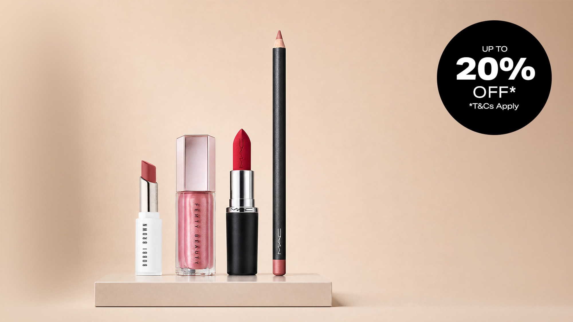Selection of lip products including lipstick, lip gloss, and lip liner in shades of red and pink