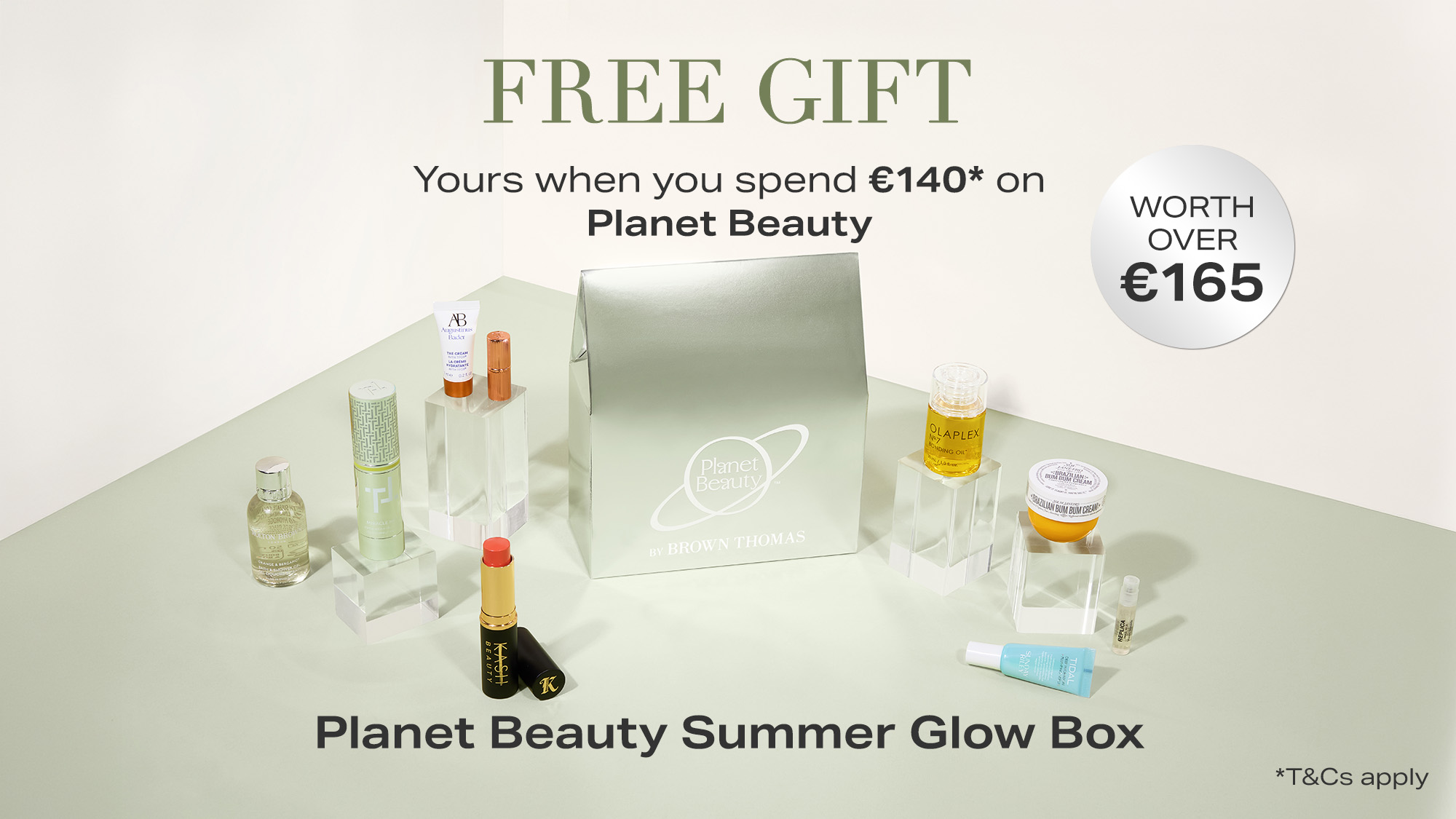 Gift offer for Planet Beauty's Summer Glow Box, valued over €165, free with €140 purchase. Products displayed around a green box.