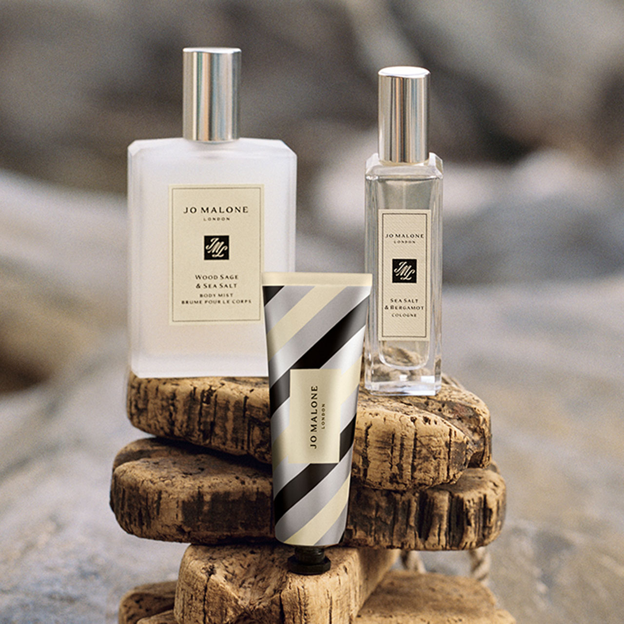 Jo Malone London travel-size products including body mist, cologne and hand cream stacked on cork blocks