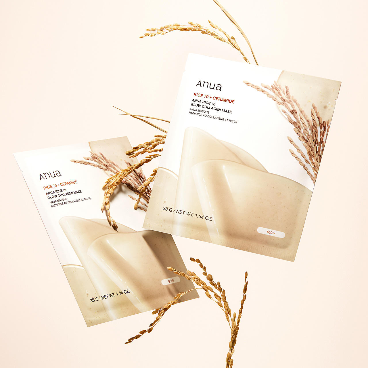 Three Anua glow collagen mask packets with rice and ceramide ingredients, decorated with dried wheat sprigs