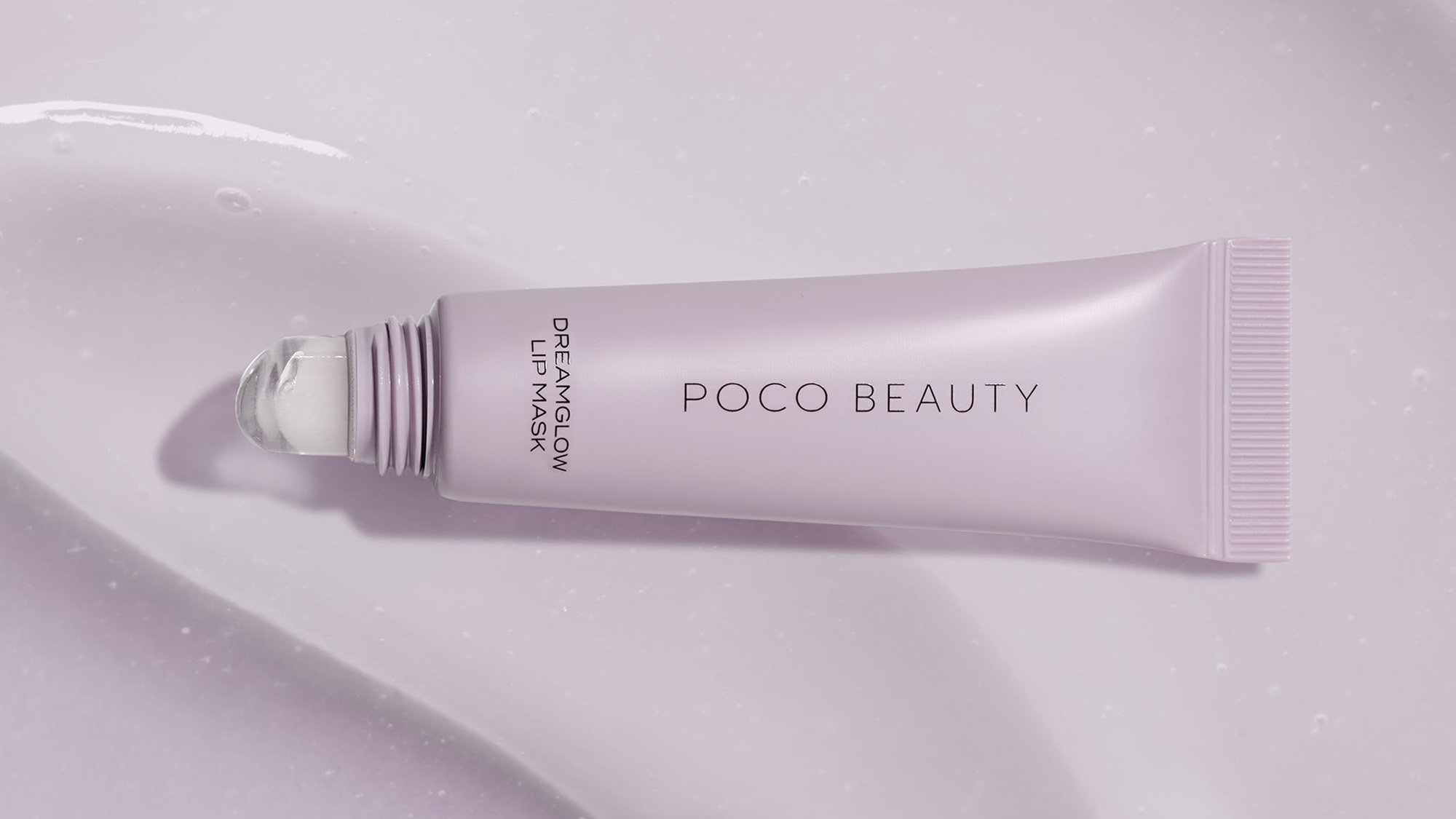 Poco Beauty Dream Glow lip mask tube on lavender background with skincare product