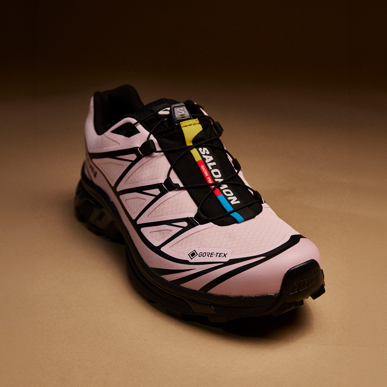 Pink and black Salomon trail running trainer with Gore-Tex waterproof lining and black laces