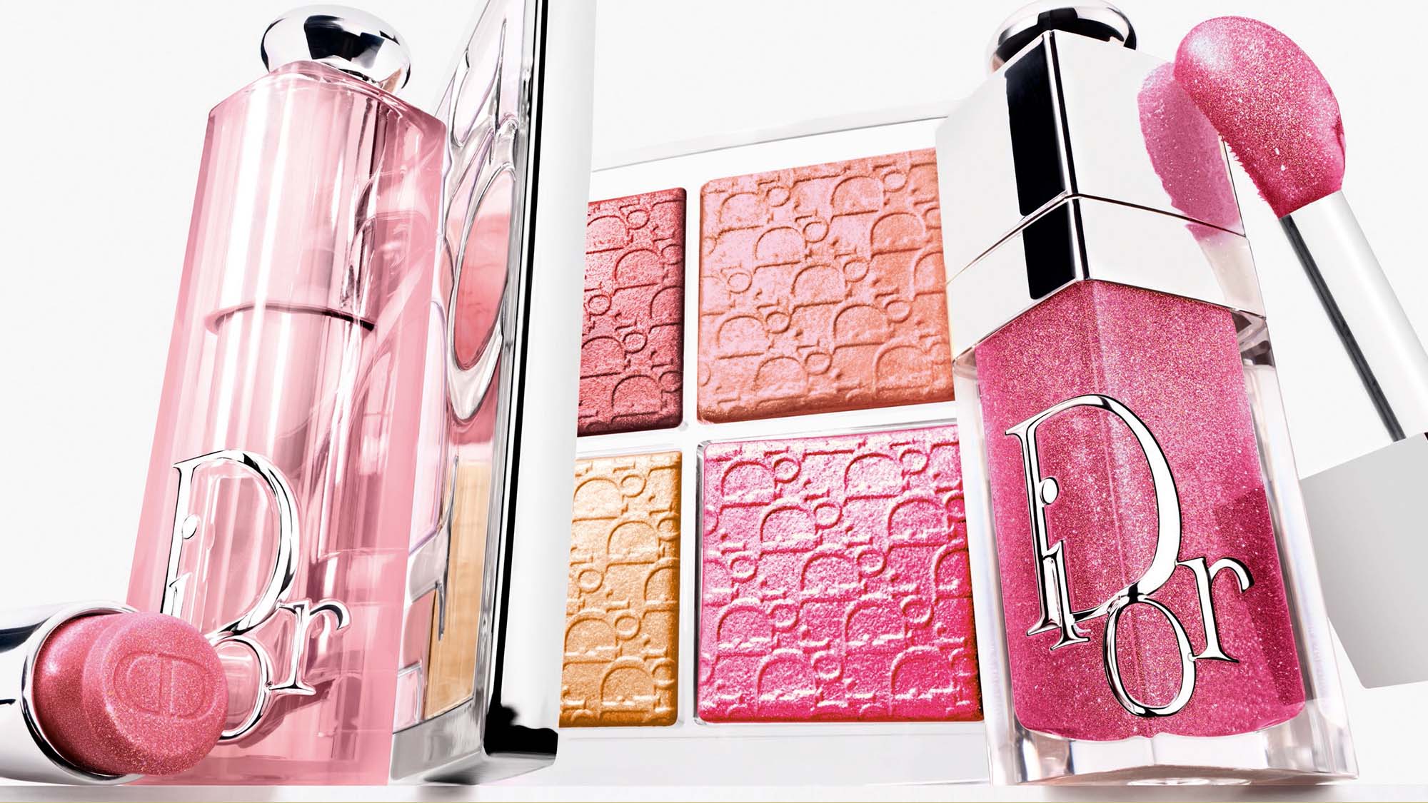 Dior Backstage cosmetics collection featuring pink lipsticks, brushes, and colourful pressed powder compacts with textured finishes