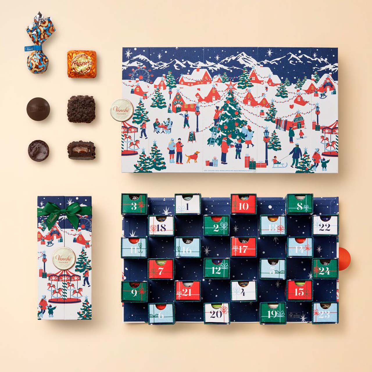Festive advent calendars featuring snowy village scenes, Christmas houses, trees, and chocolate treats in numbered boxes