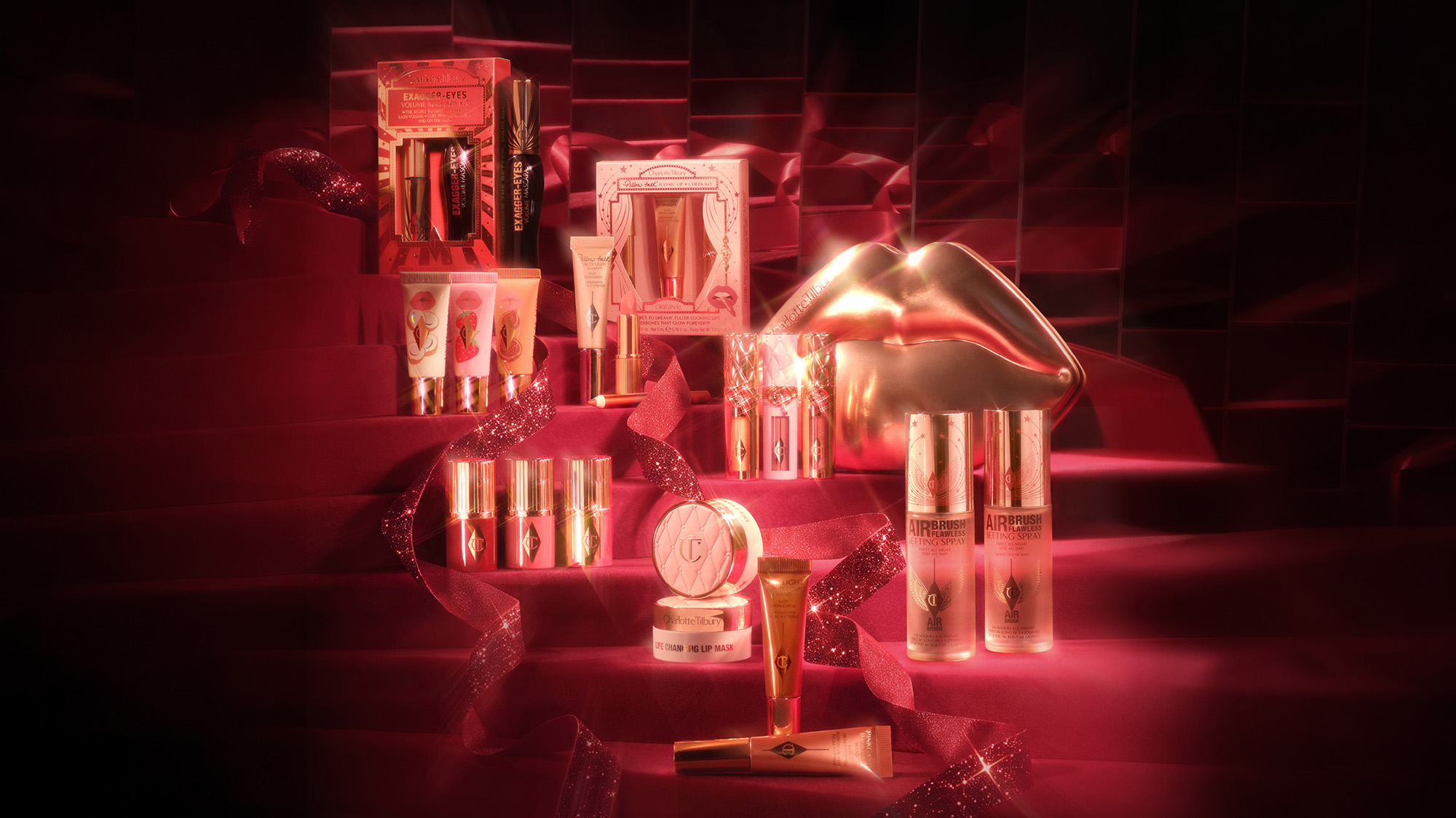 Charlotte Tilbury beauty products including lipsticks, mascaras and serums on red display with neon lighting