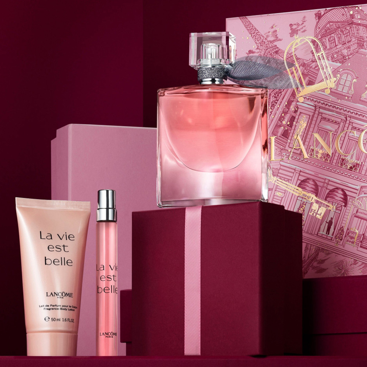 Lancôme La Vie Est Belle fragrance set with bottle, body lotion, and pink illustrated gift box