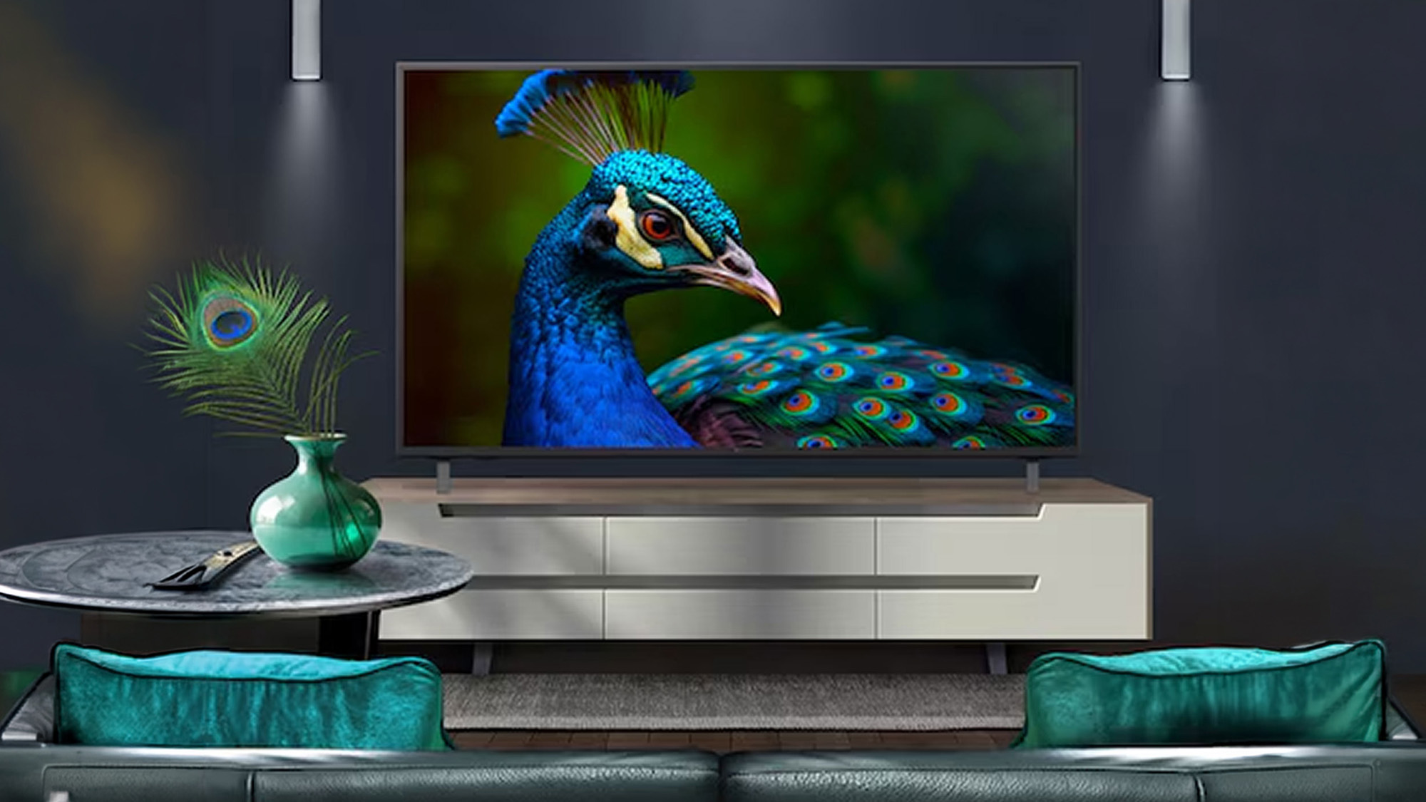 Modern living room with flat-screen TV displaying peacock close-up, white media unit, teal cushions and green vase