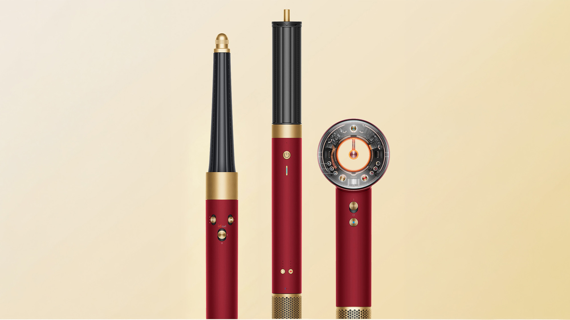 Three red and gold hair styling tools with different attachments displayed vertically on a beige background.