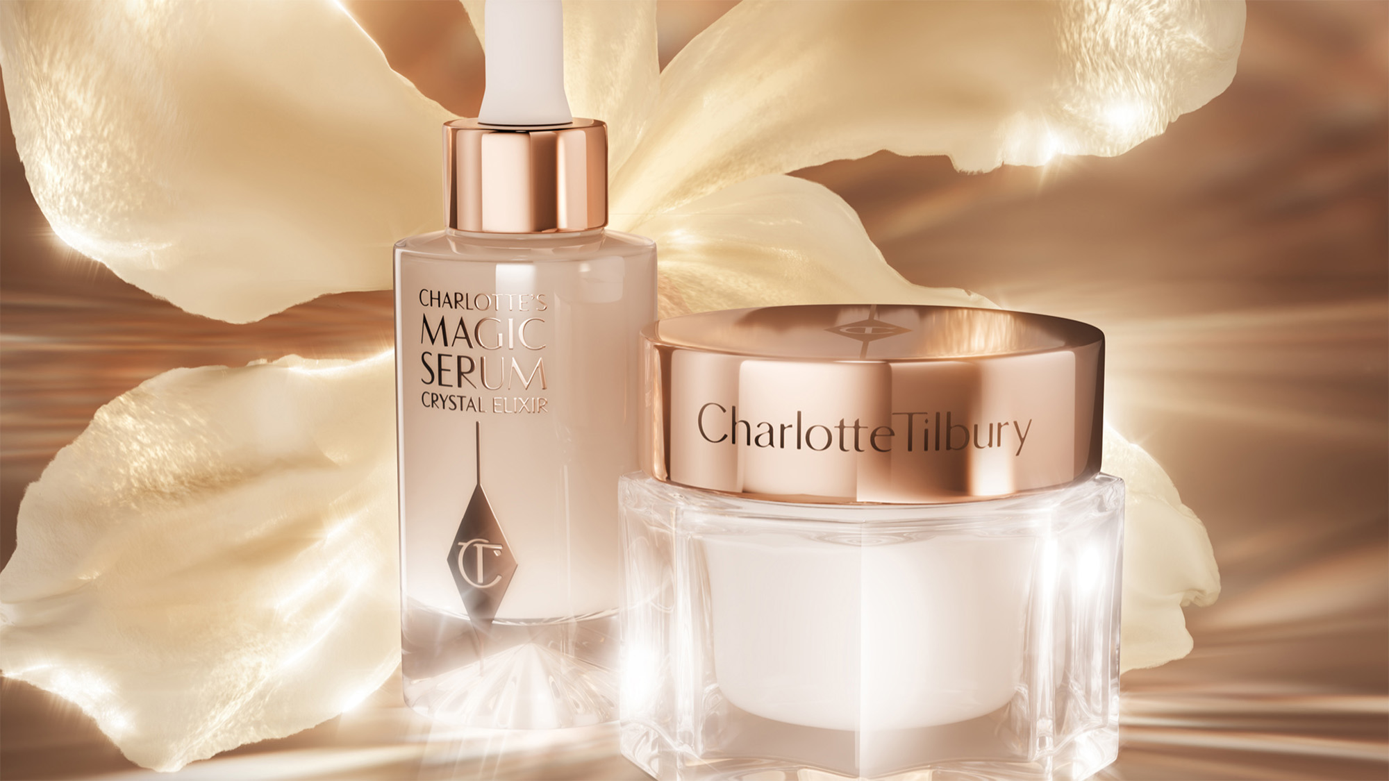 Charlotte Tilbury skincare products, including a serum and cream, are displayed against a soft, floral background.