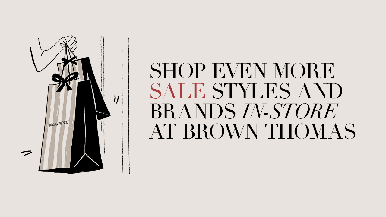 Illustration of a hand holding shopping bags with text promoting a sale at Brown Thomas.