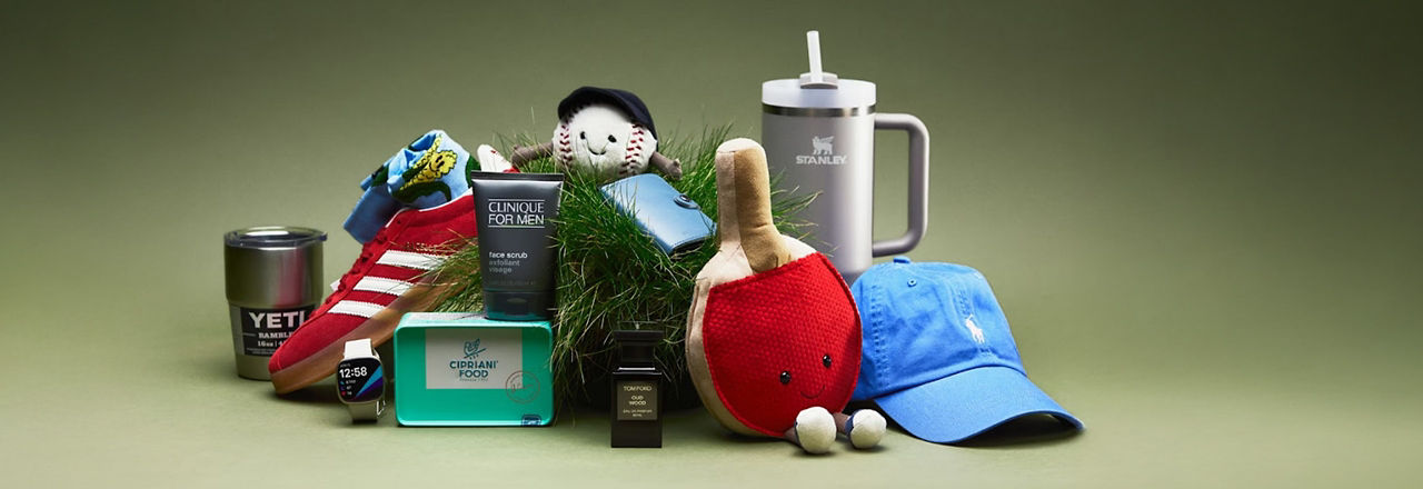 A collection of assorted items including a shoe, mug, plush toy, cap, candle, and skincare products arranged on a green background.