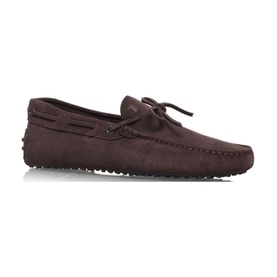 Tod's Classic Gommino Tie Driving Shoes in brown suede leather, slip-on loafer with lace-up trim and rubber pebble sole