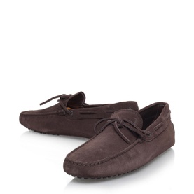 Tod's Classic Gommino Tie Driving Shoes in brown suede leather with lace-up trim, stitched front, and rubber pebble sole
