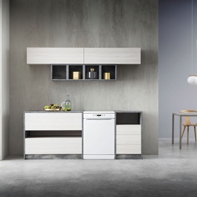 Whirlpool 14 Place 6th Sense White Dishwasher installed in a modern kitchen with pale wood cabinetry and wall-mounted open shelving units
