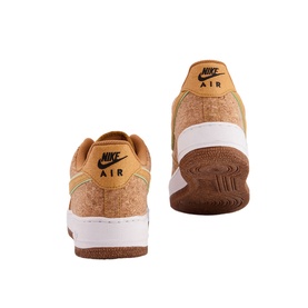 Nike Air Force 1 07 Trainers in cork-textured tan upper with white midsole, gum rubber sole, and black Nike Air branding, rear view