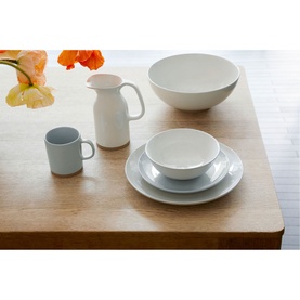 Royal Doulton Olio White 500ml Jug styled on wood table with matching white dinnerware set and orange floral arrangement