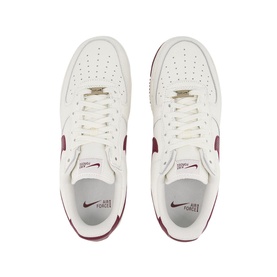 Nike Air Force 1 07 Trainers in white with burgundy Swoosh branding, lace fastening and chunky rubber sole, overhead view