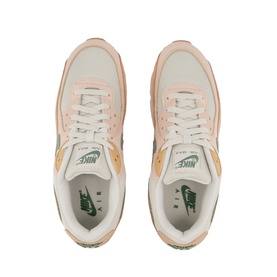 Nike Air Max 90 Trainers in beige with pink and gold accents, green branding tab, white laces, overhead view of pair
