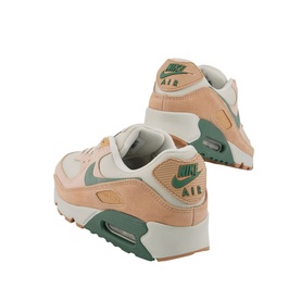 Nike Air Max 90 Trainers in beige with sage green swoosh and Air unit, gum rubber sole, shown from rear angle