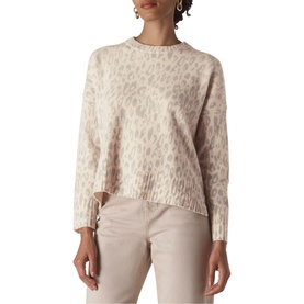 Model wearing Whistles Animal Print Merino Sweater in cream with leopard print, styled with light beige trousers
