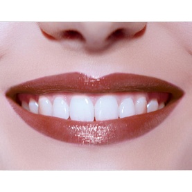 Model wearing Armani Beauty Ecstasy Shine Lipstick in a warm nude-brown shade, showing glossy finish on smiling lips