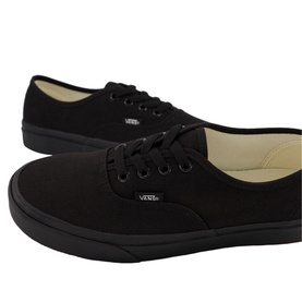 Vans Authentic Low Tops in black canvas with black laces, black rubber sole, and signature Vans logo tab on heel