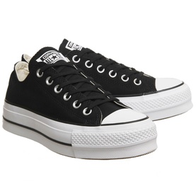 Converse All Star Platform Low Tops in black canvas with white platform sole, silver eyelets and lace-up front, pair shot