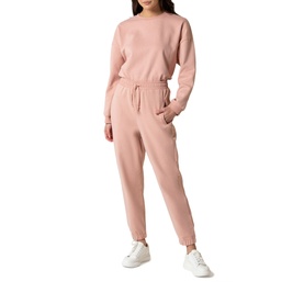 Model wearing Forever New Alexa High Waisted Jogger in pink with matching pink sweatshirt and white trainers