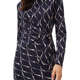 Model wearing Phase Eight Ally Print Dress in blue with geometric print, long sleeves, and tie waist detail