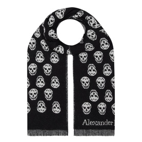 Alexander McQueen Reversible Skull Scarf in black with allover white skull print, fringe edges, and embroidered logo detail