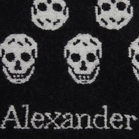 Alexander McQueen Reversible Skull Scarf in black, featuring allover cream skull jacquard pattern and brand name detail