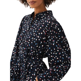 Model wearing Phase Eight Alexandra Ditsy Print Shirt Dress in blue with all-over tulip print, shirt collar, and long sleeves visible