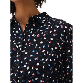 Model wearing Phase Eight Alexandra Ditsy Print Shirt Dress in blue with all-over tulip print, shirt collar and button fastenings visible
