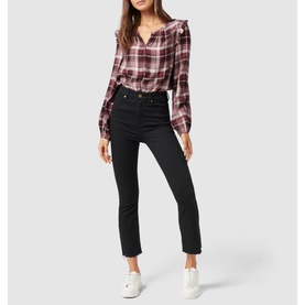 Model wearing Forever New Amy Checked Frill Shoulder Blouse in red check, styled with black cropped jeans and white trainers