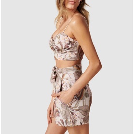Model wearing Forever New Amena Crop Bustier Co-ord Top in pink floral print, styled with matching tie-waist mini skirt