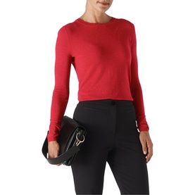 Model wearing Whistles Annie Sparkle Knit in red, long sleeve crew neck style, paired with black trousers and a black shoulder bag