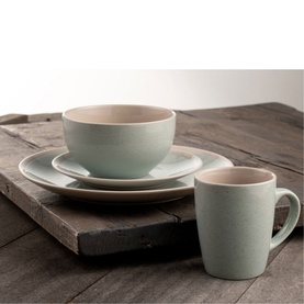 Belleek Aqua Stoneware 16 Piece Set in green, showing bowl, plate, side plate and mug with two-tone matte ceramic finish on rustic wood surface