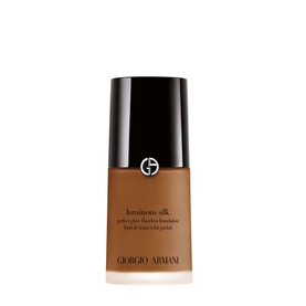 Armani Beauty Luminous Silk Foundation in a deep tan shade, glass bottle with black cap and gold logo