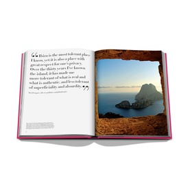 Assouline Ibiza Bohemia hardbound book open to spread featuring coastal cliffs, turquoise sea, and printed quote about Ibiza