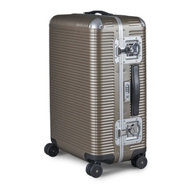 FPM Bank Light Spinner 68 hardshell luggage in brown with silver aluminium frame, ribbed exterior, and four spinner wheels