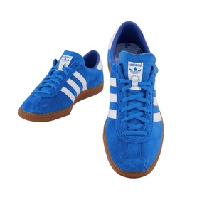Adidas Bleu Trainers in blue suede with white three stripes, lace-up low top, heel tab, and gum rubber sole