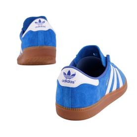 Adidas Bleu Trainers in blue suede with white three stripes, heel tab, and gum rubber sole, shown from rear angle