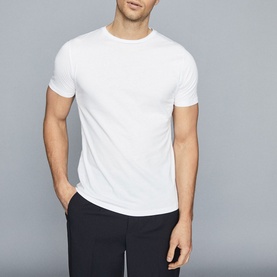 Model wearing Reiss Bless Regular Fit T-Shirt in white, round neckline, short sleeves, styled with navy shorts