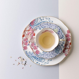 Wedgwood Butterfly Bloom teacup with saucer and plate, white bone china with floral and swirl motifs in pink and blue, gold trim