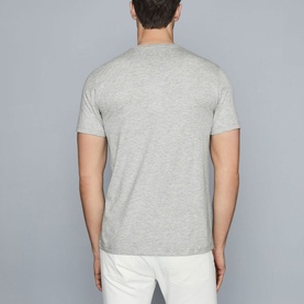 Model wearing Reiss Bless Regular Fit T-Shirt in grey, back view, round neck, short sleeves, paired with white trousers