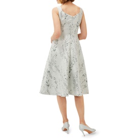 Model wearing Phase Eight Becka Trailing Jacquard Dress in green, sleeveless with sweetheart neckline and floral jacquard fit and flare skirt