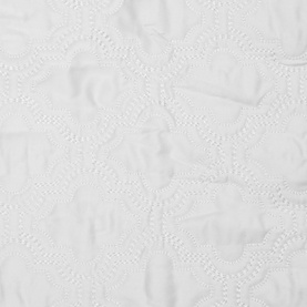Valeron La Mer Bedspread in white, close-up of embroidered circular lace-style textured fabric detail, 270x260cm